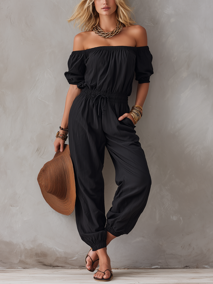 Sveva | Tuta nera off-shoulder dalla linea morbida