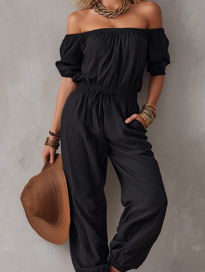 Sveva | Tuta nera off-shoulder dalla linea morbida