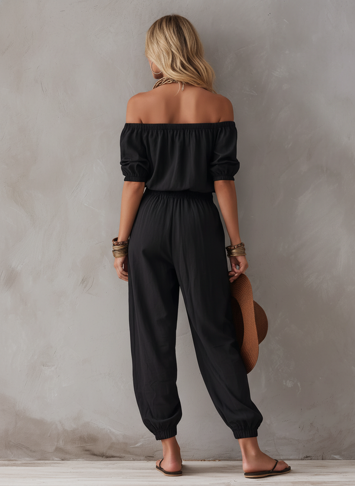 Sveva | Tuta nera off-shoulder dalla linea morbida