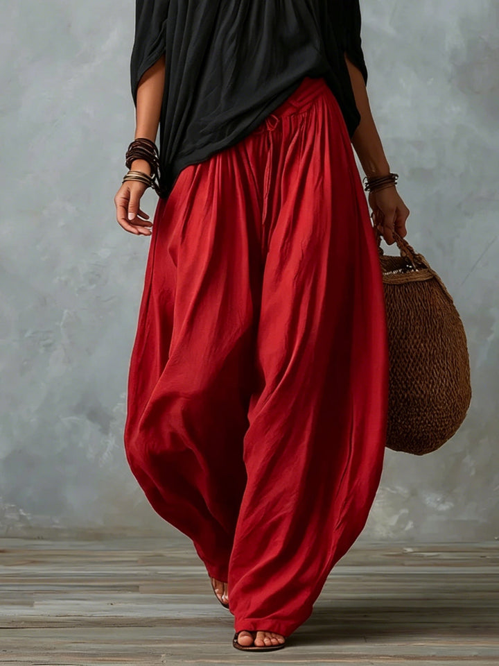 Carmela | Completo due pezzi con top nero off-shoulder e pantaloni lanterna rossi