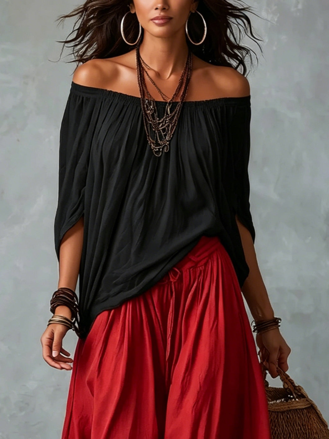 Carmela | Completo due pezzi con top nero off-shoulder e pantaloni lanterna rossi