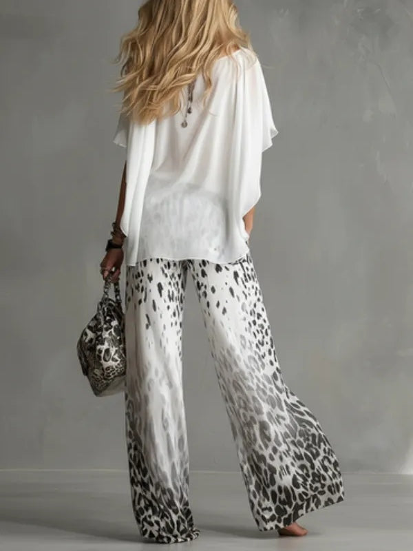 Arabella | Completo con top a mantella e pantaloni leopardati a gamba larga
