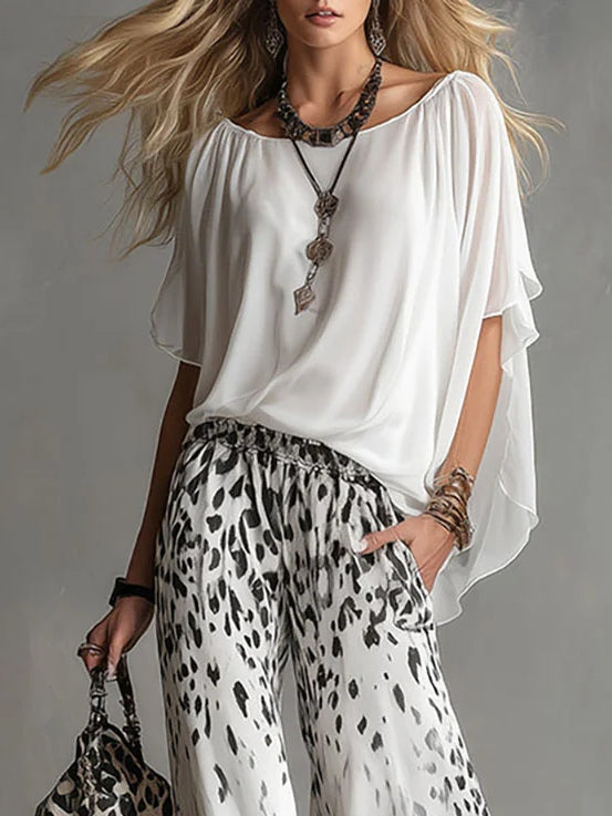 Arabella | Completo con top a mantella e pantaloni leopardati a gamba larga