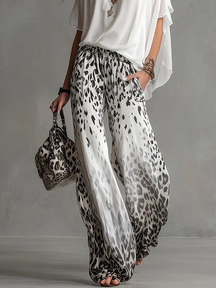 Arabella | Completo con top a mantella e pantaloni leopardati a gamba larga